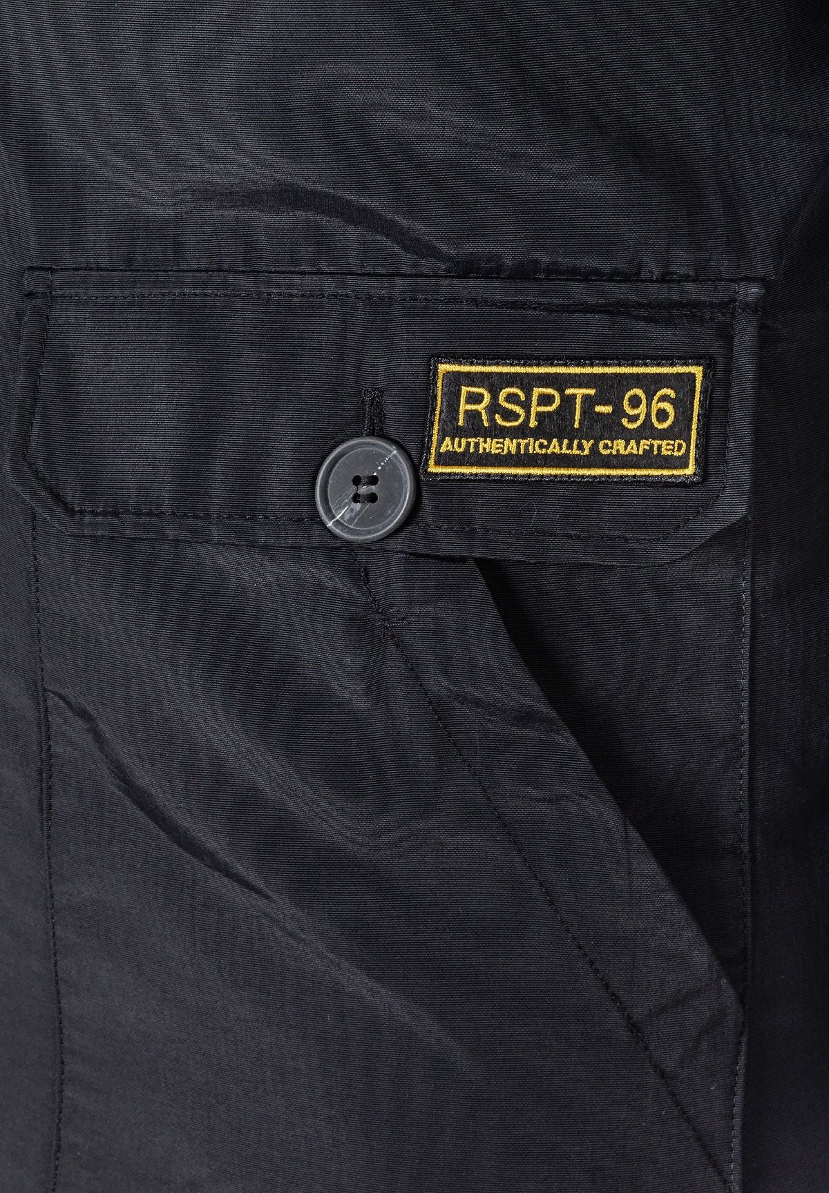 Close-up of the pocket on the black parka.
