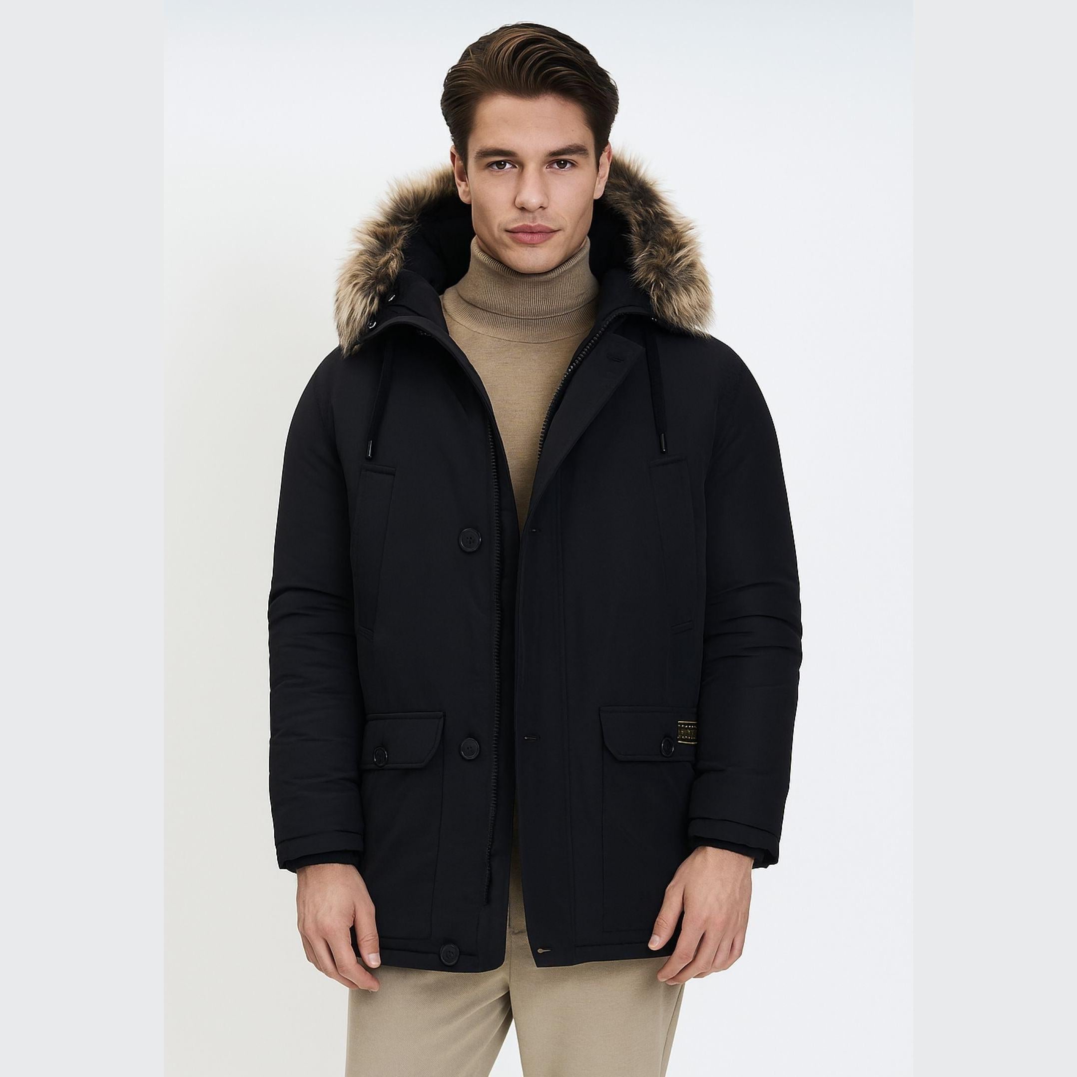 Men's black padded parka jacket with a faux fur hood, multiple pockets, and a discreet badge detail.
