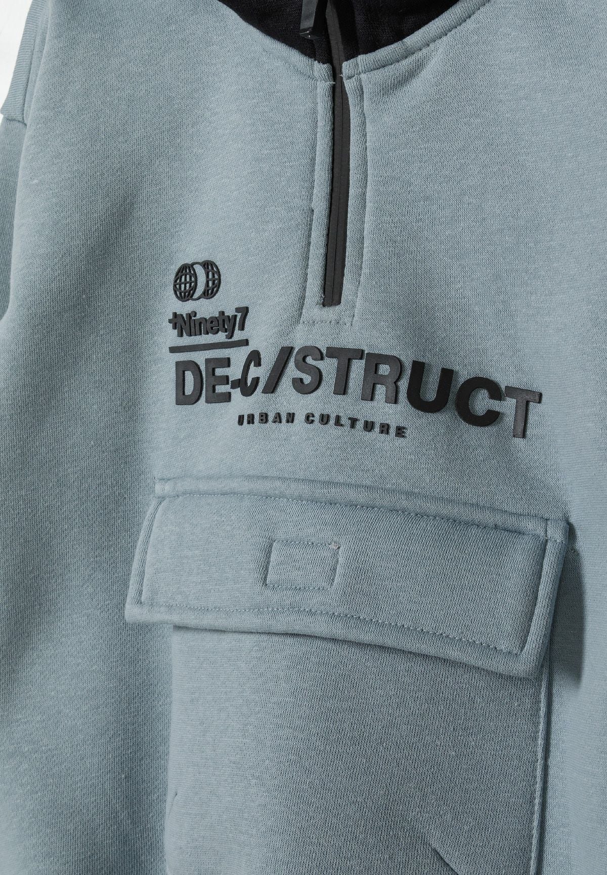 Blue grey and black quarter-zip hoodie, zip and pocket detail.
