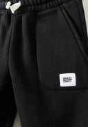 Boys black slim fit joggers with badge