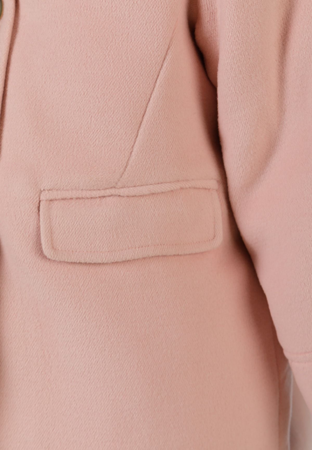 Close-up of the pocket on the pink hooded coat.