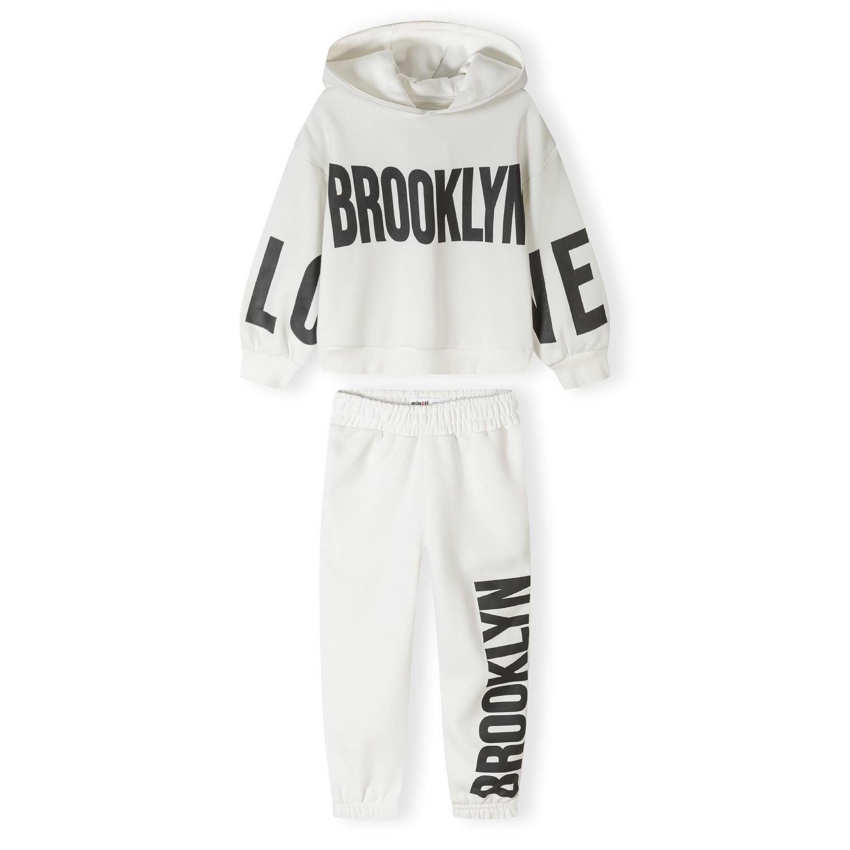 Back view of white hoodie with hood up against neutral background showing relaxed fit and fabric texture