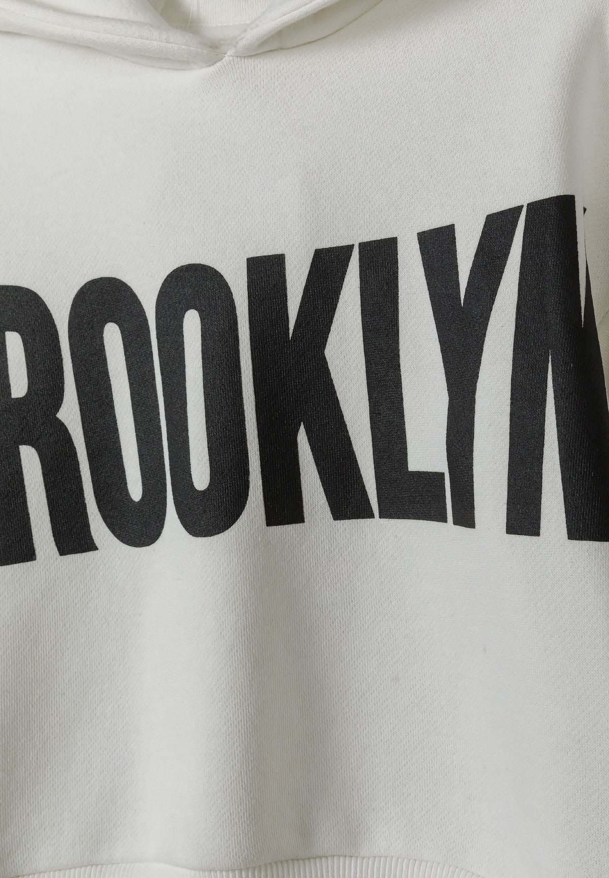White hoodie and joggers set, brooklyn chest lettering.