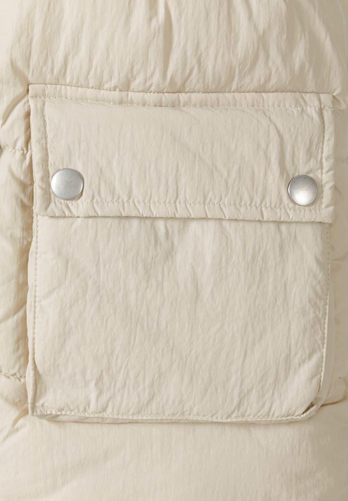 Cream longline padded gilet, pocket detail.