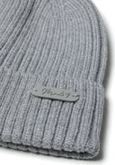 Knitted ribbed beanie in gray with sewn badge detail. Soft texture for warmth. Ideal for children aged 2-14 years.