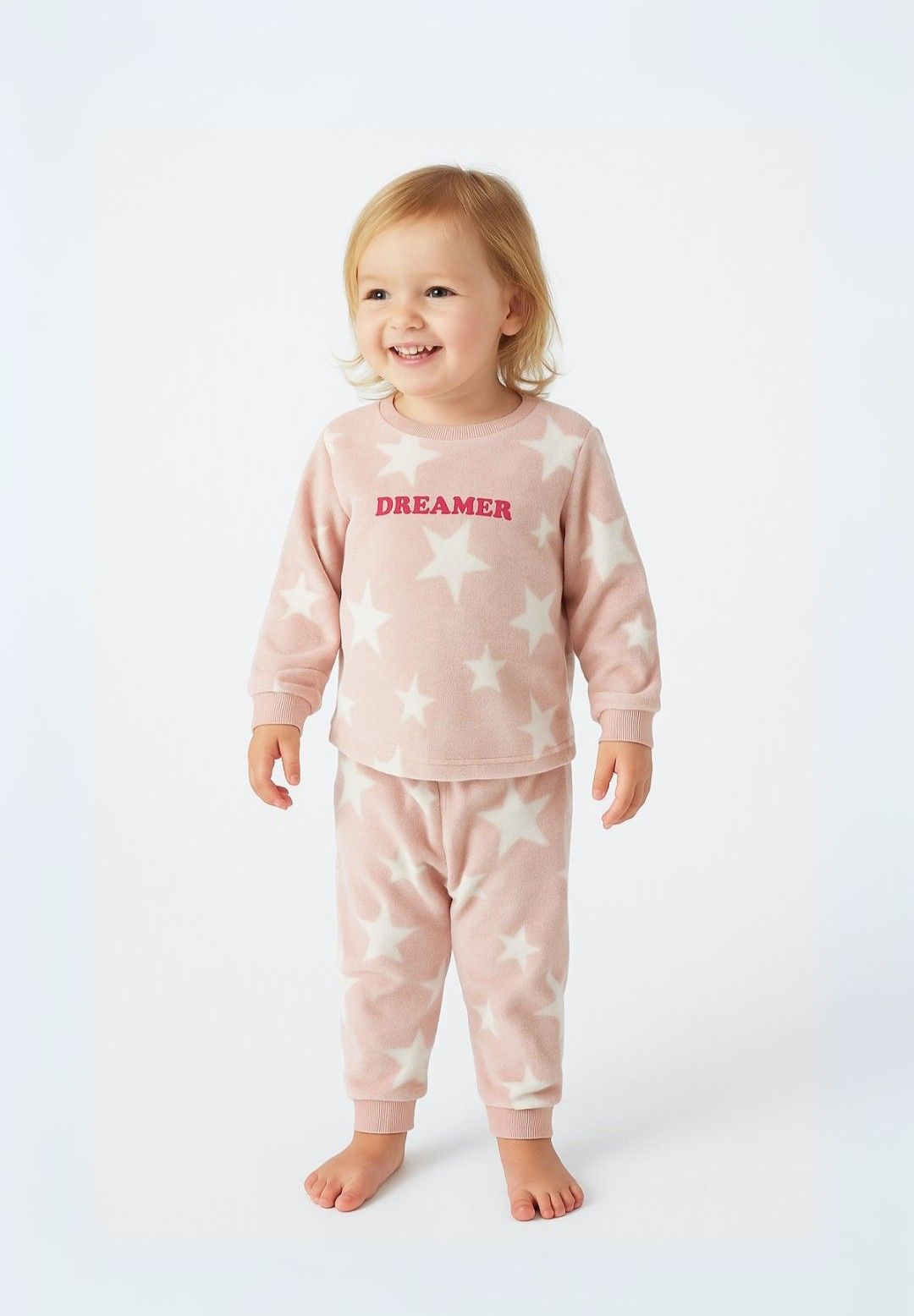 Pink and white fleece pyjamas, model front.