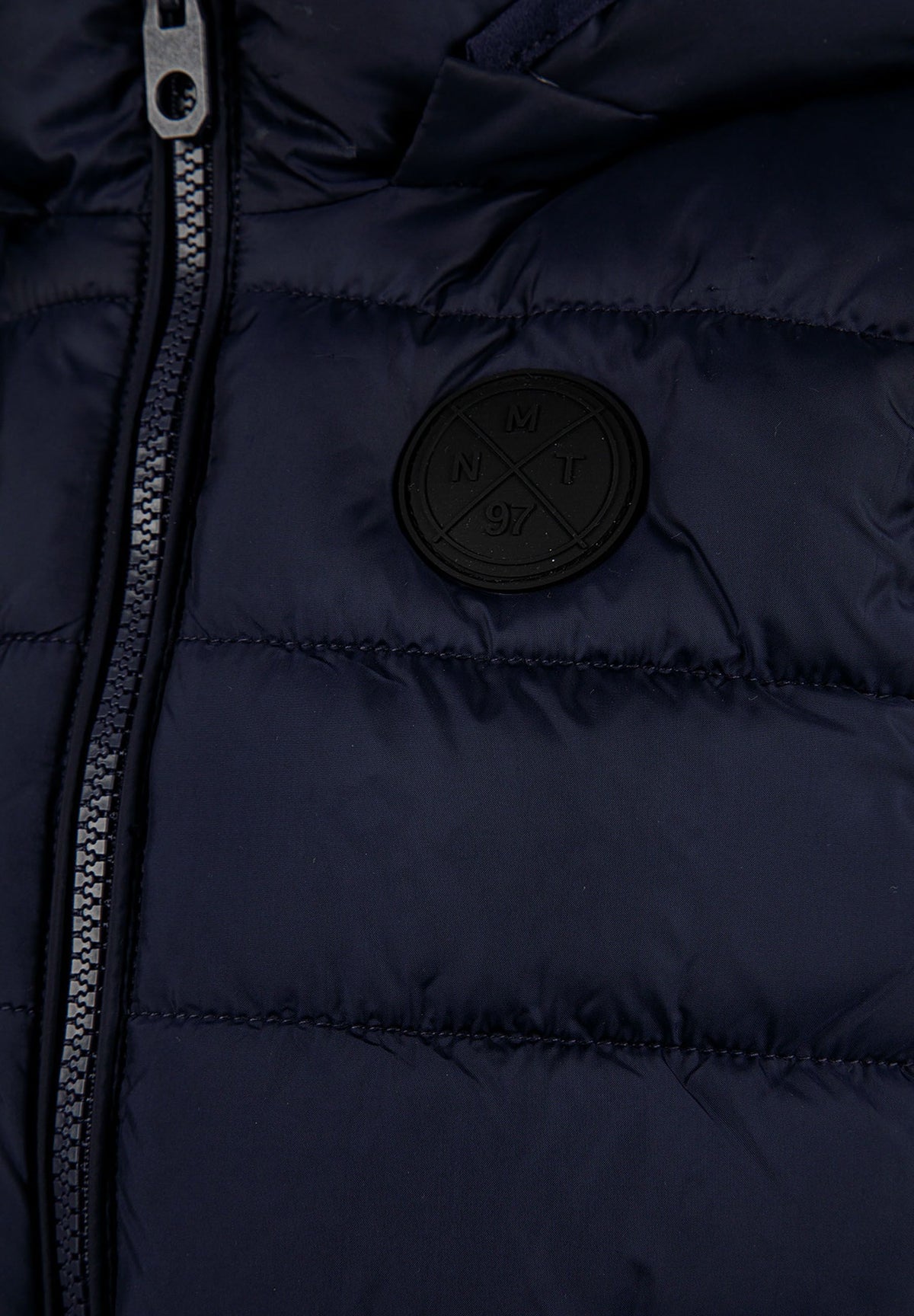 Navy padded gilet, badge detail.