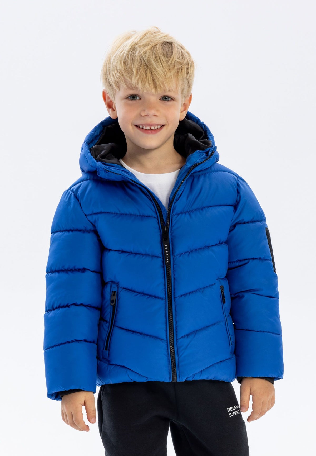 Boys' blue puffer jacket, shown worn.