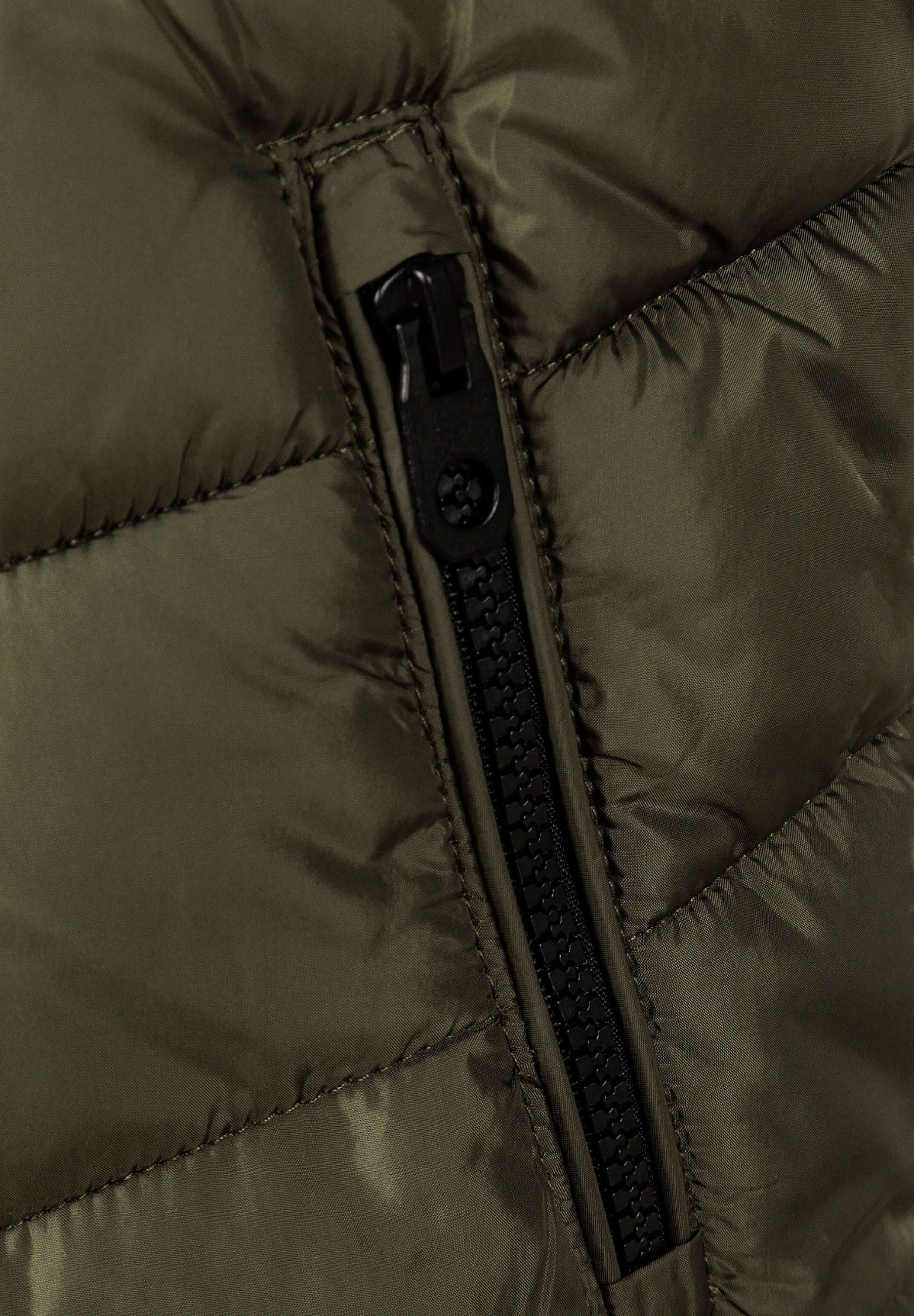 Close-up of khaki boys gilet featuring a full-length zip and padded texture.