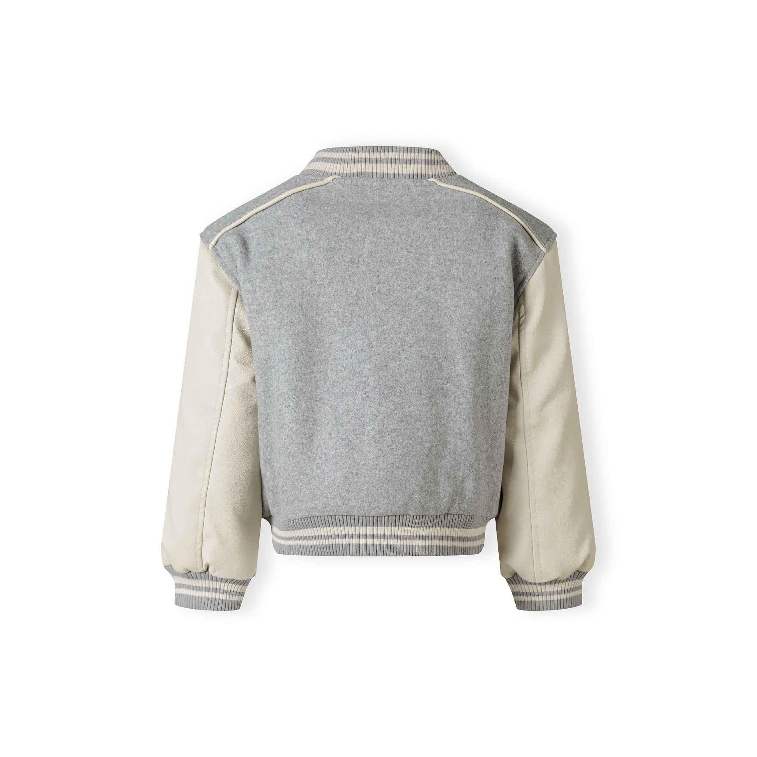 Back view of grey baseball jacket showing ribbed collar and contrasting cream faux leather sleeves against white background