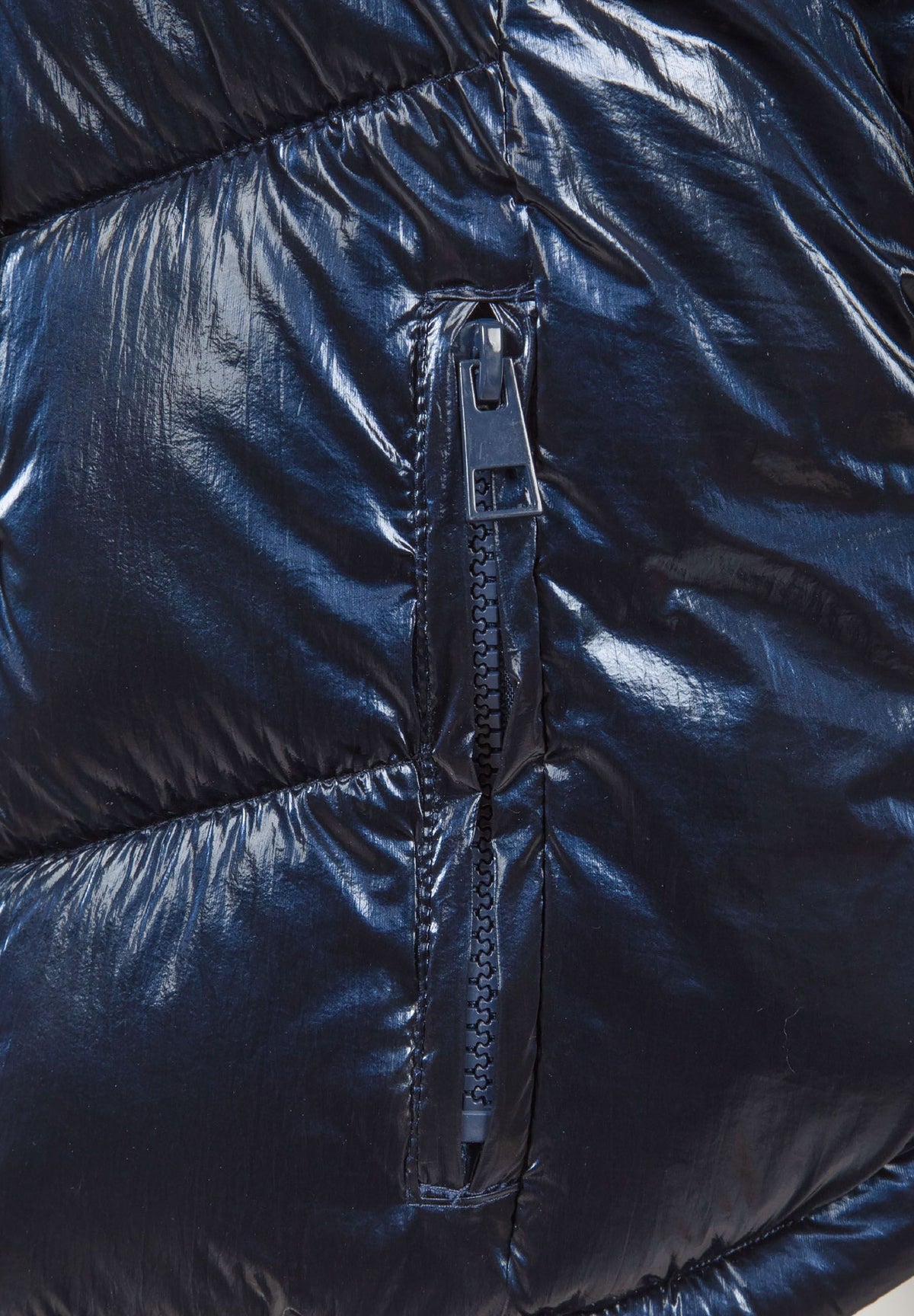Close-up of a dark navy vertical zipper on the puffer jacket's side pocket.