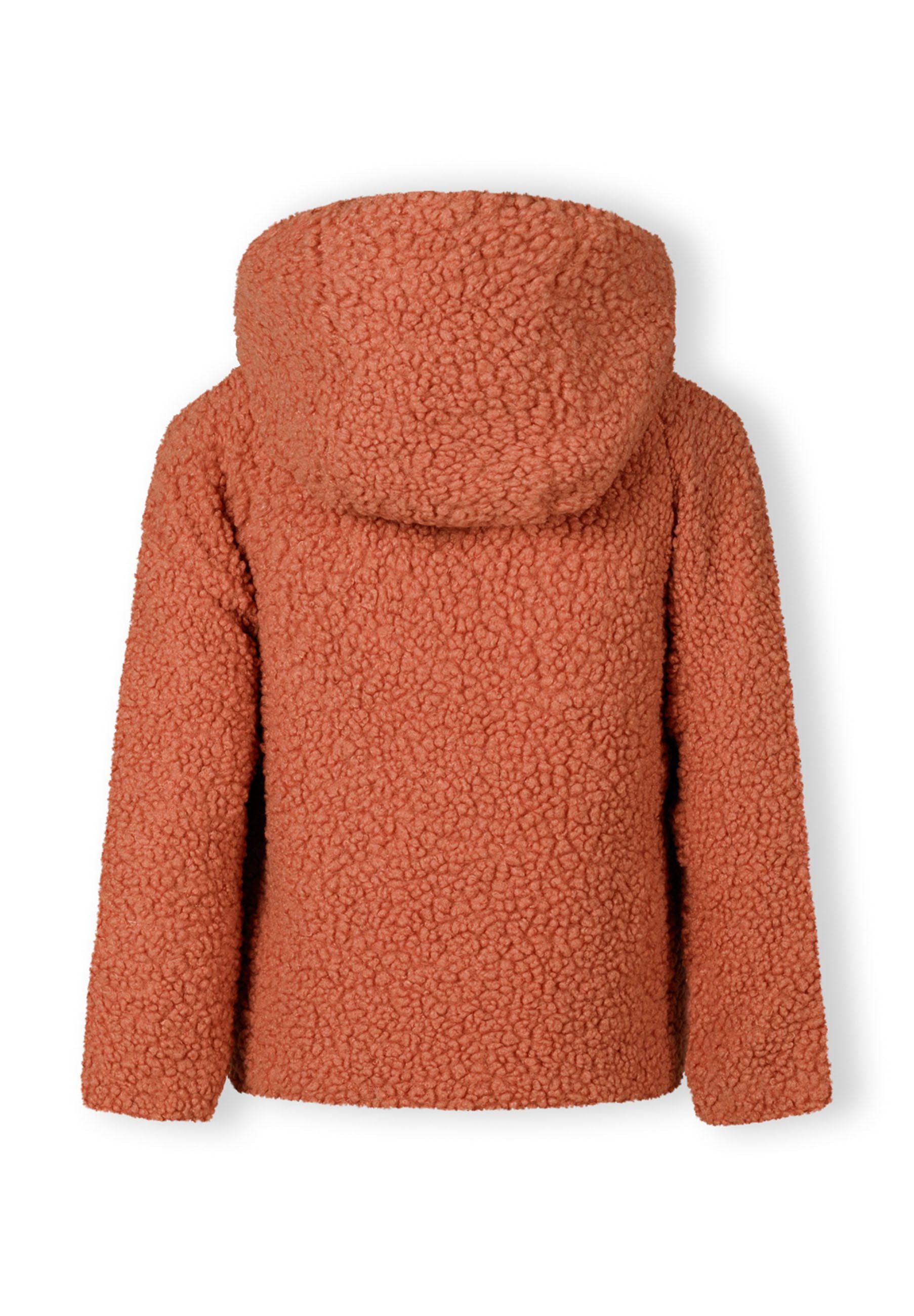 Back view of a girls teddy fleece jacket in soft pink with a hood and textured surface.