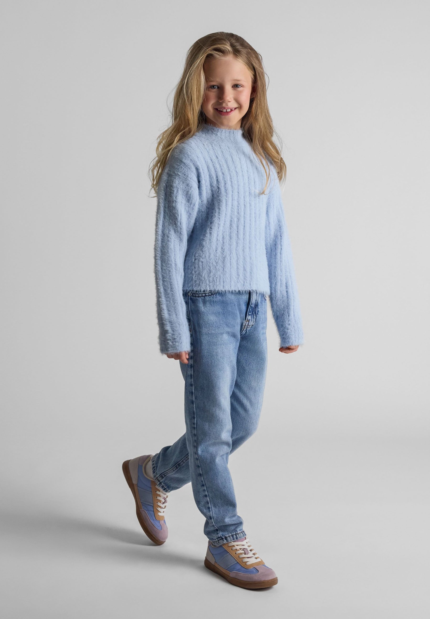 Girls high neck jumper in soft fluffy blue, front view with ribbed cuffs.