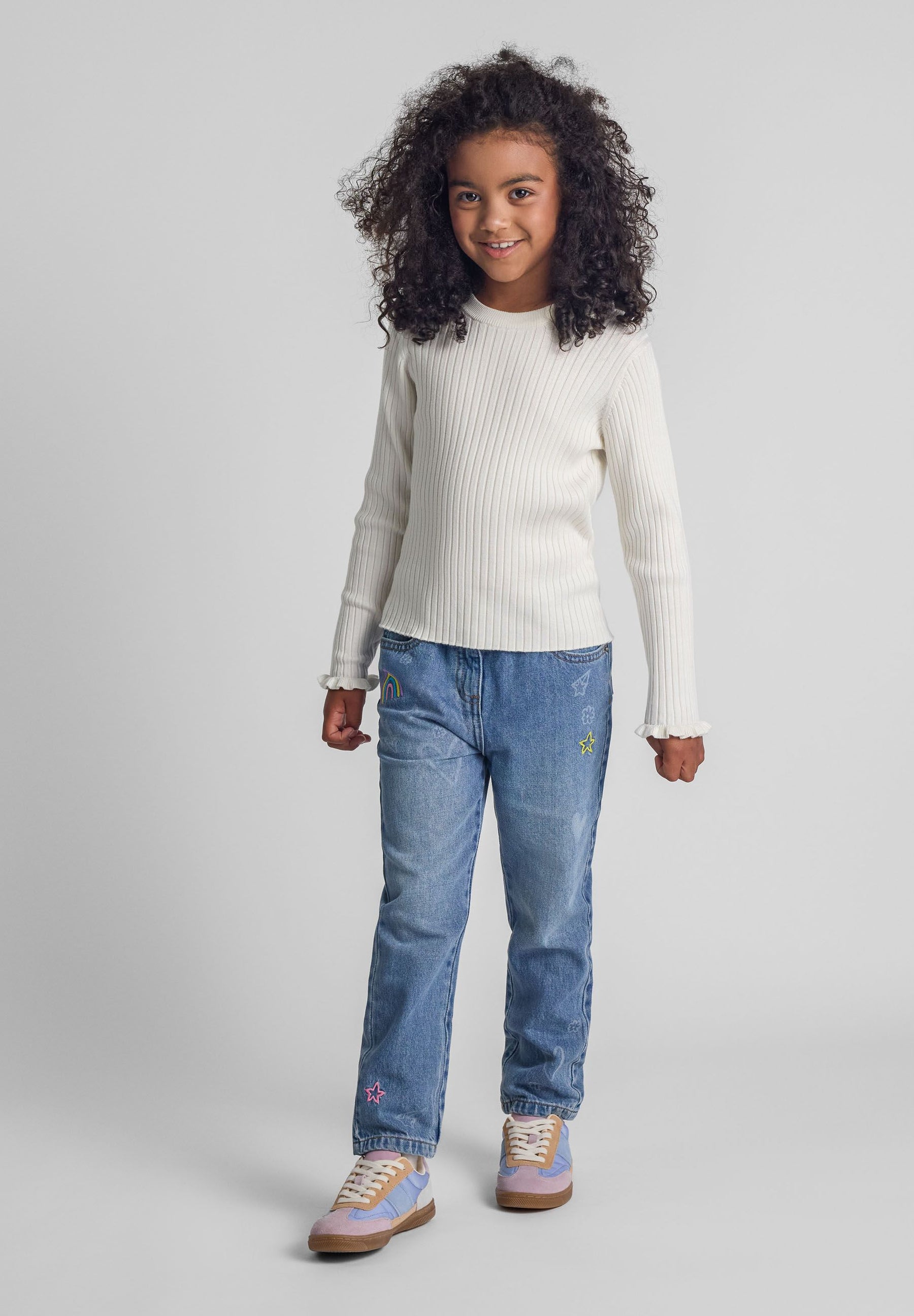 Girls ribbed long sleeve jumper with frill cuffs, front view.
