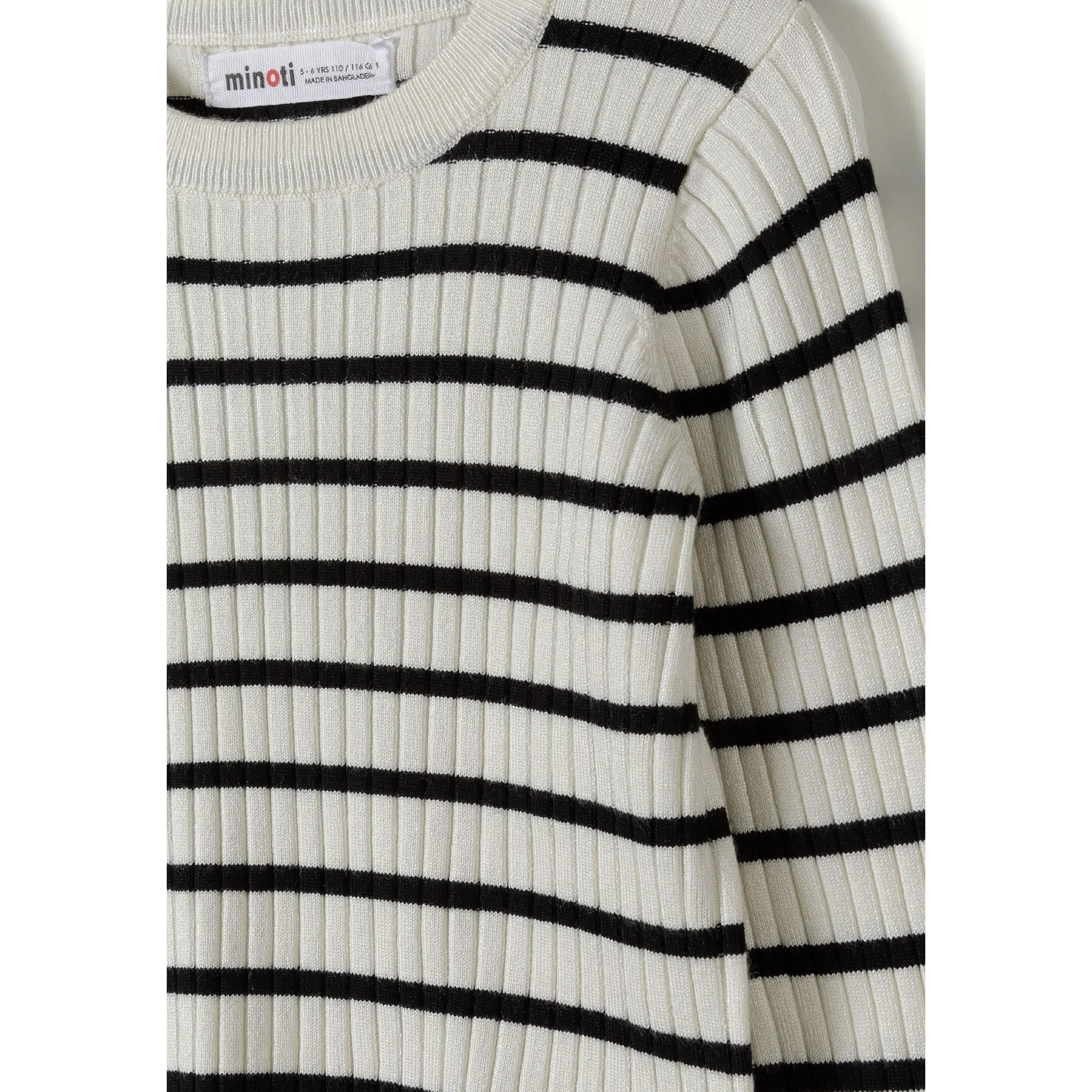 Close-up detail of cream and black striped ribbed fabric showing Minoti label and frill cuff texture
