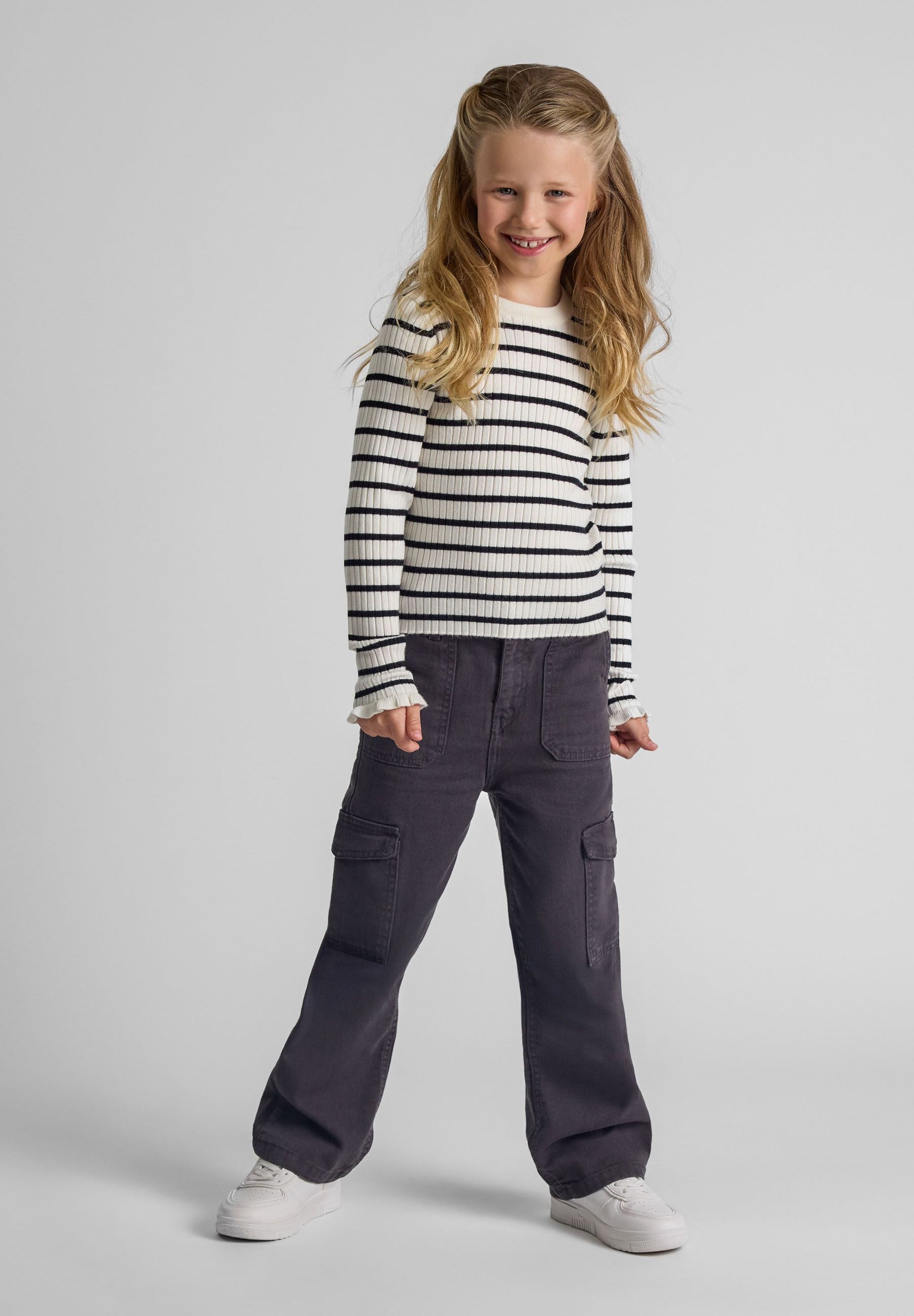 Girls wide leg combat pants in grey, front view with side cargo pockets.