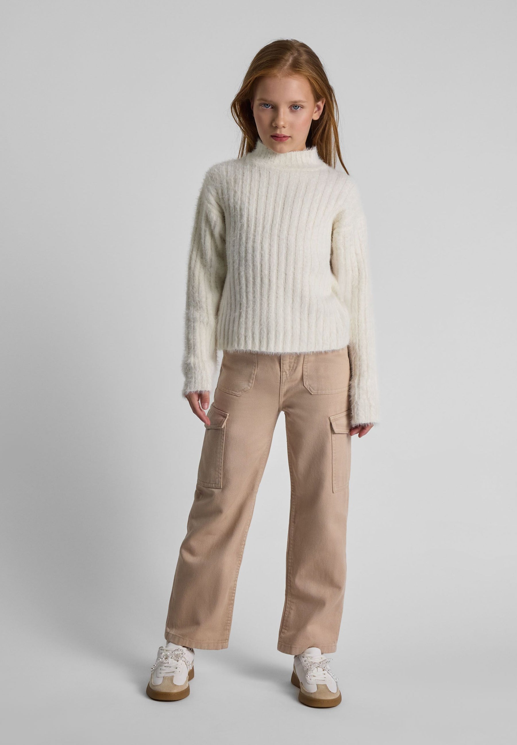 Girls wide-leg combat pants in beige, front view with side cargo pockets.