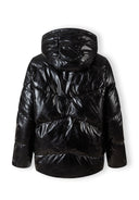 Back view of a women's black quilted short hooded jacket with zip and pockets.