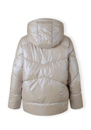 Back view of a women's quilted short jacket with a hood and elasticated cuffs.