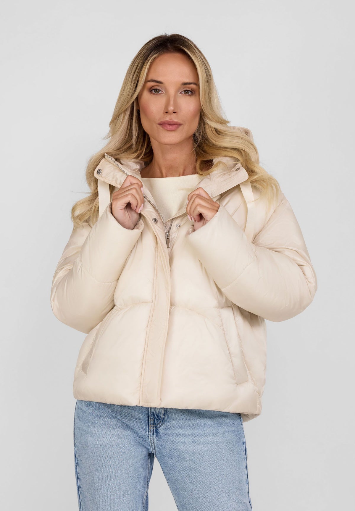 Women's cream puffer jacket, shown worn.