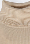 Close-up of a beige women's turtleneck jumper with ribbed collar.