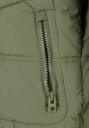 Detail of a khaki boys quilted jacket featuring a zip pocket.