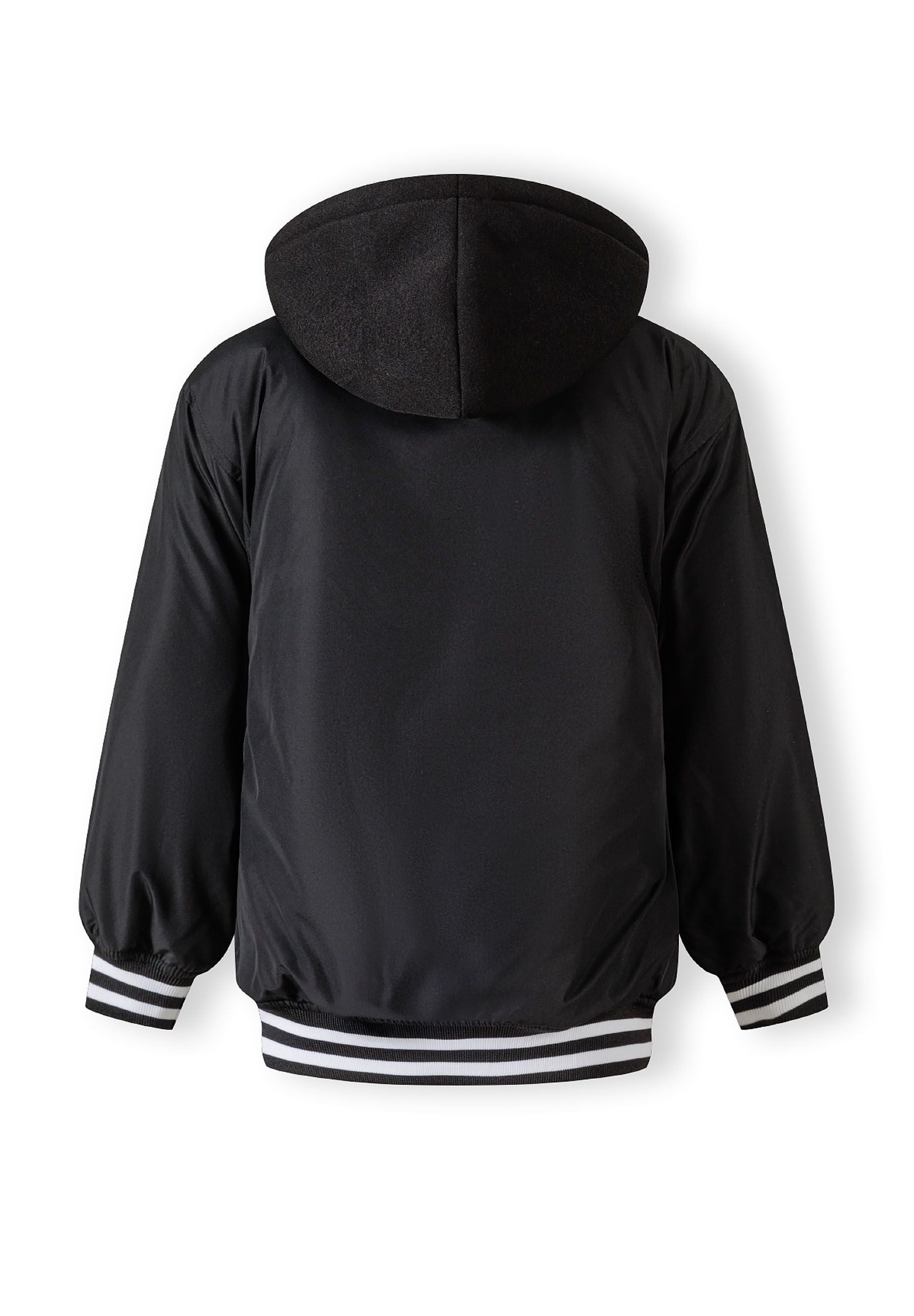 Boys baseball style jacket in black, back view with detachable hood and striped cuffs.