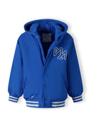 Boys baseball style jacket in cobalt blue, front view with detachable hood and chest embroidery.