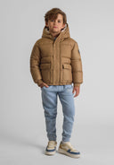Boys beige jacket with hood, front view, featuring snap button pockets.