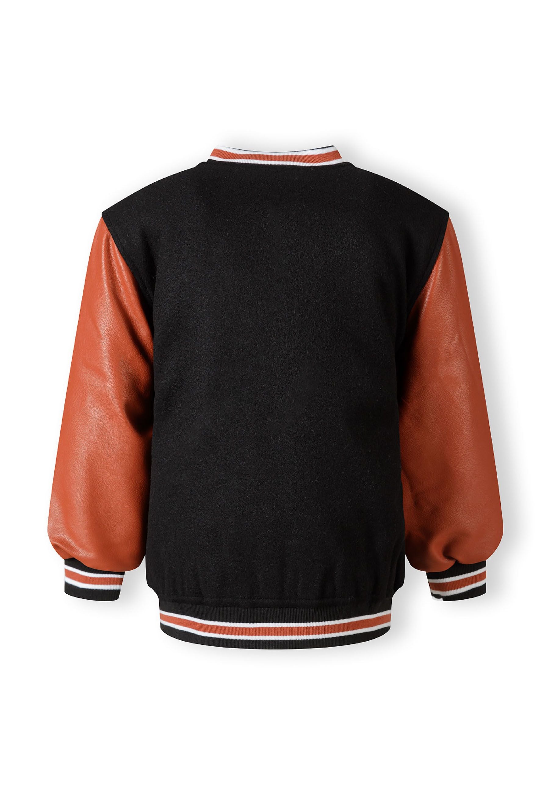 Boys varsity jacket, black body with PU sleeves, back view, ribbed cuffs and hem.