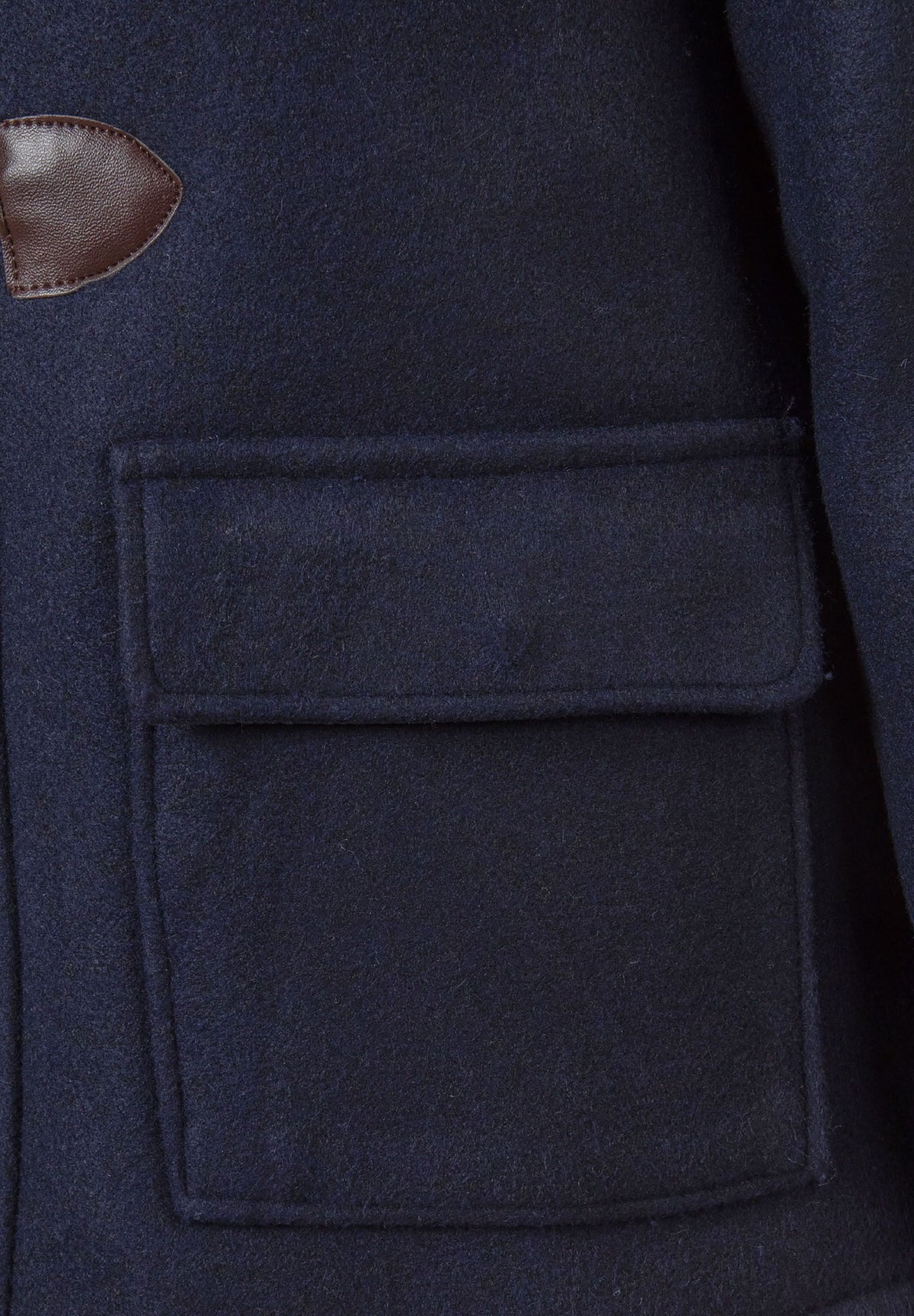 Close-up of the pocket on the navy duffle coat.
