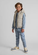 Boys padded grey gilet with hood, front view, featuring zip closure and side pockets.