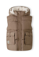 Beige boys gilet with a fixed hood, snap pockets, and a zip closure.