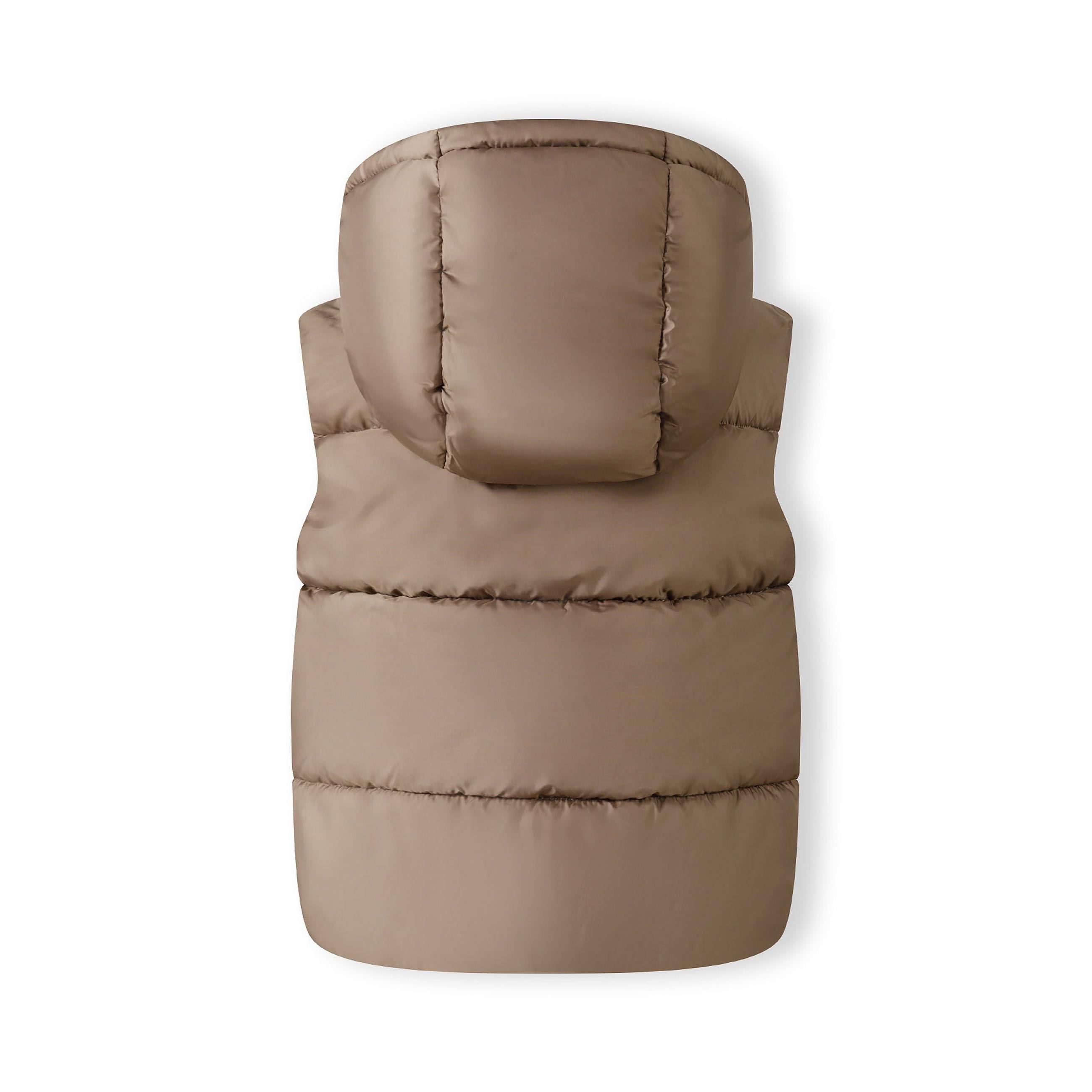 Front view of boy wearing beige quilted hooded gilet over blue sweatshirt with beige cargo trousers on grey background