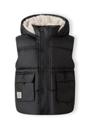 Boys black gilet with hood, snap-button pockets, and high collar, front view.