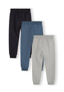 Set of three boys joggers in navy tones with ribbed cuffs and drawcord, front view.