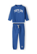 Boys sweatshirt and joggers set in cobalt blue, featuring 'TOKYO JPN' print and side tape detail.