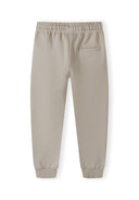 Detail of boys joggers in light grey with ribbed ankle cuffs and side pocket.