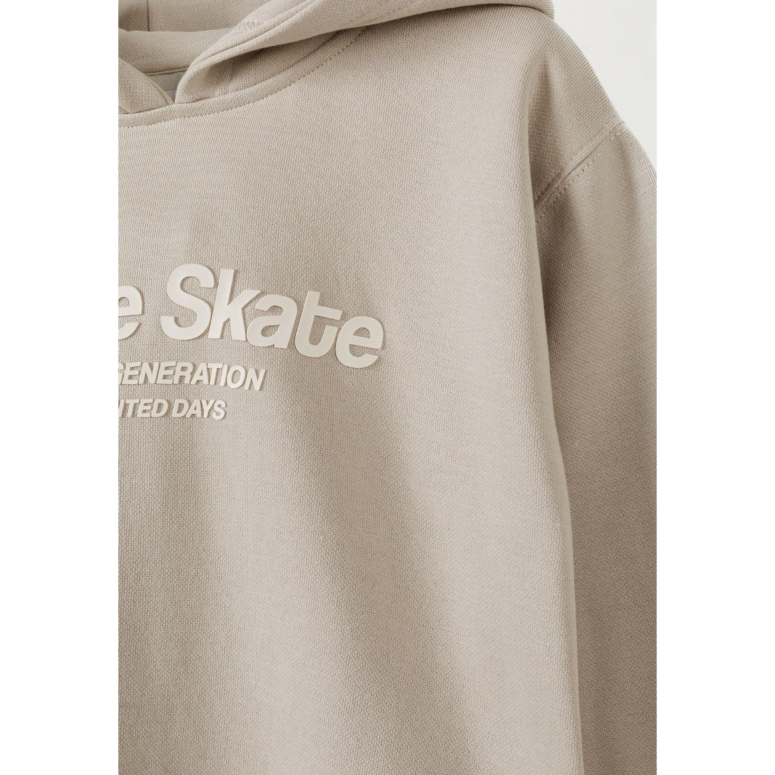 Close-up detail of grey joggers showing elastic waistband with drawstring, side pocket and Future Skate text print along the leg seam