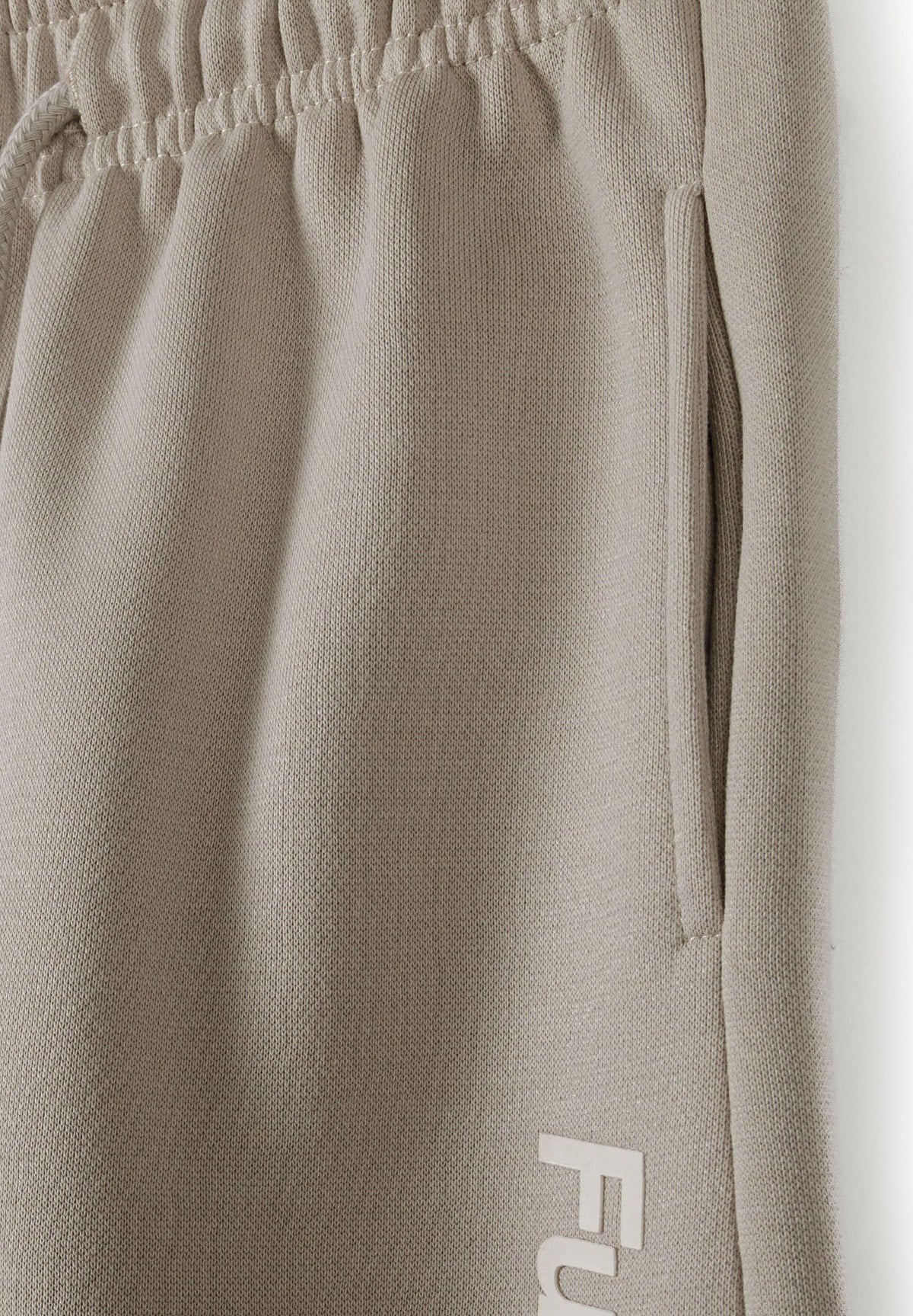 Taupe hoodie and joggers set, waist and pocket detail.