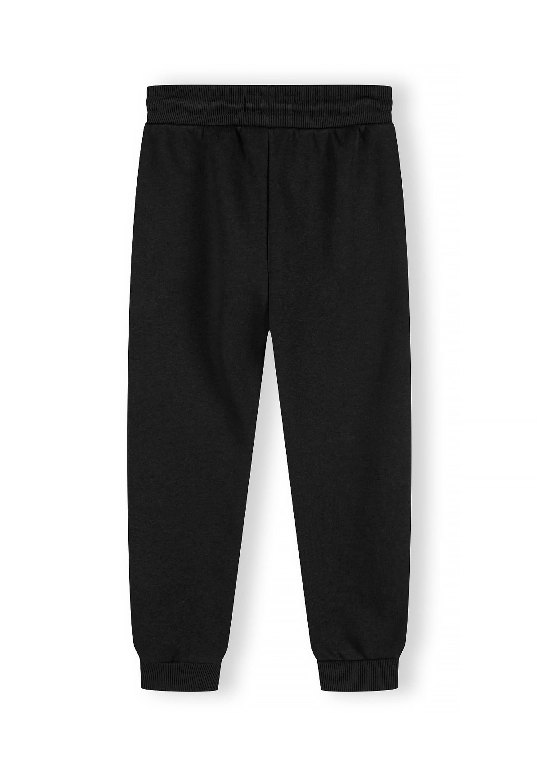 Boys joggers in black, back view with ribbed cuffs and adjustable drawcord.