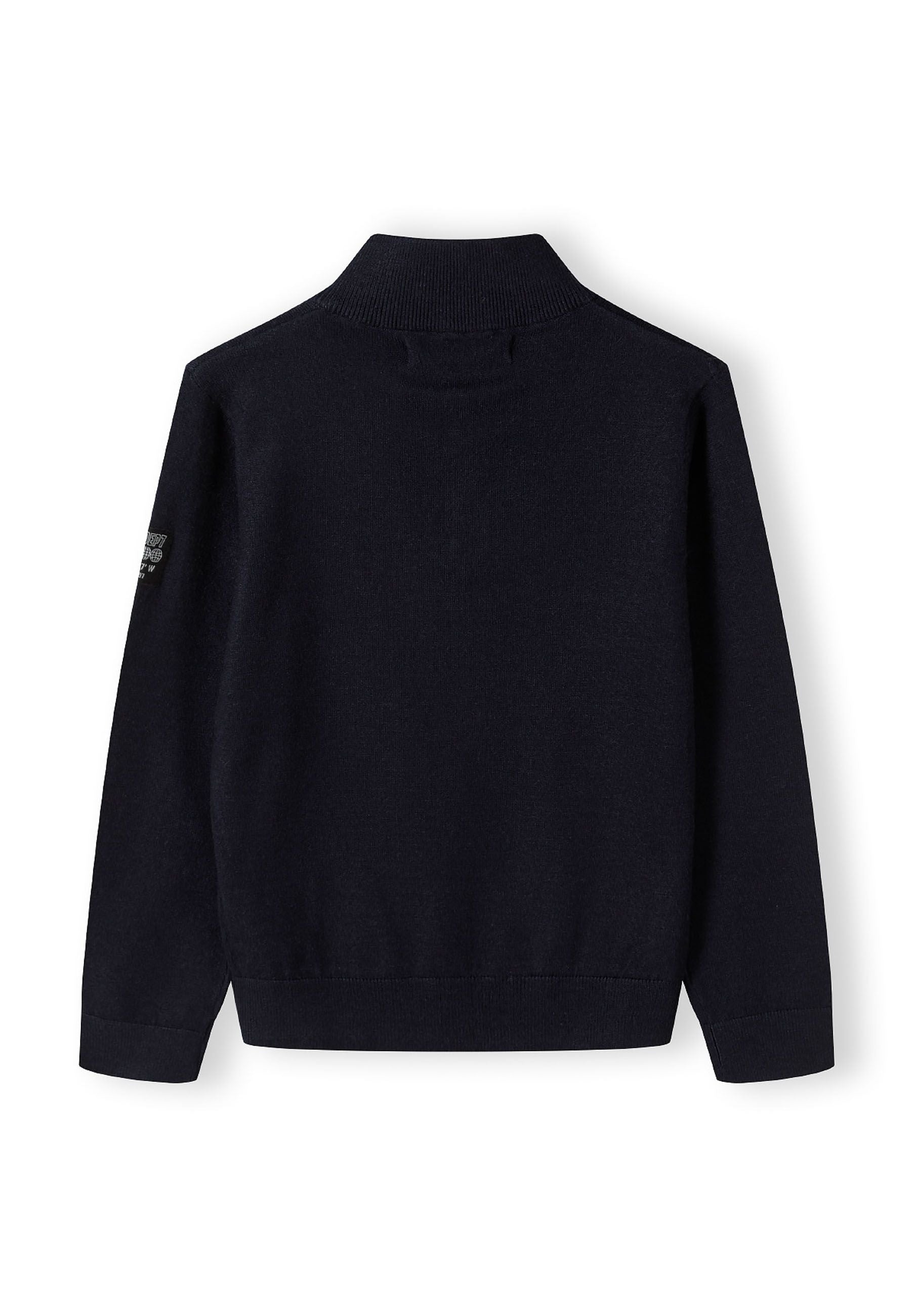 Boys half zip jumper, navy, back view with stand collar and ribbed cuffs.