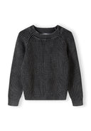 Boys black ribbed jumper with raglan sleeves, close-up view.