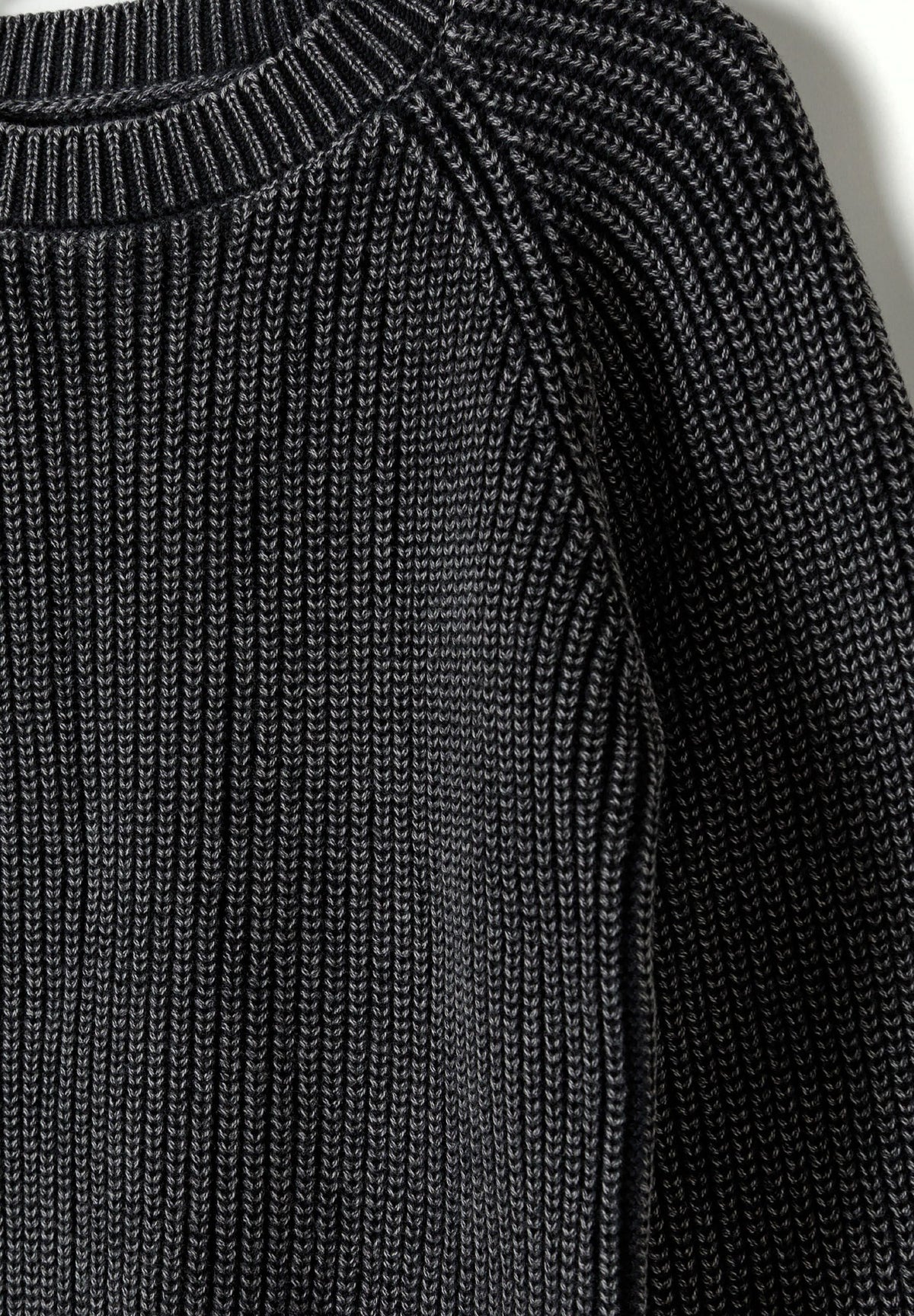 Washed black ribbed jumper, knit and neckline detail.
