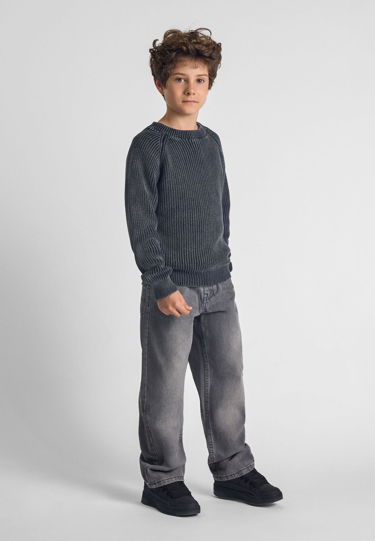 Washed black ribbed jumper, model front.