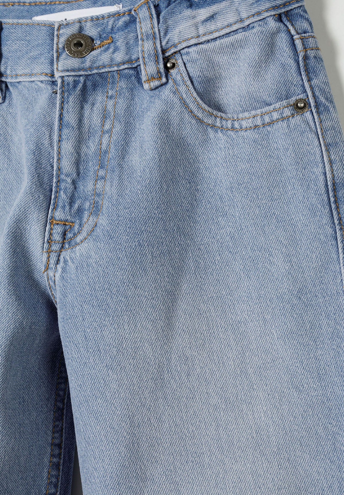 Light blue wide-leg jeans, waist detail.
