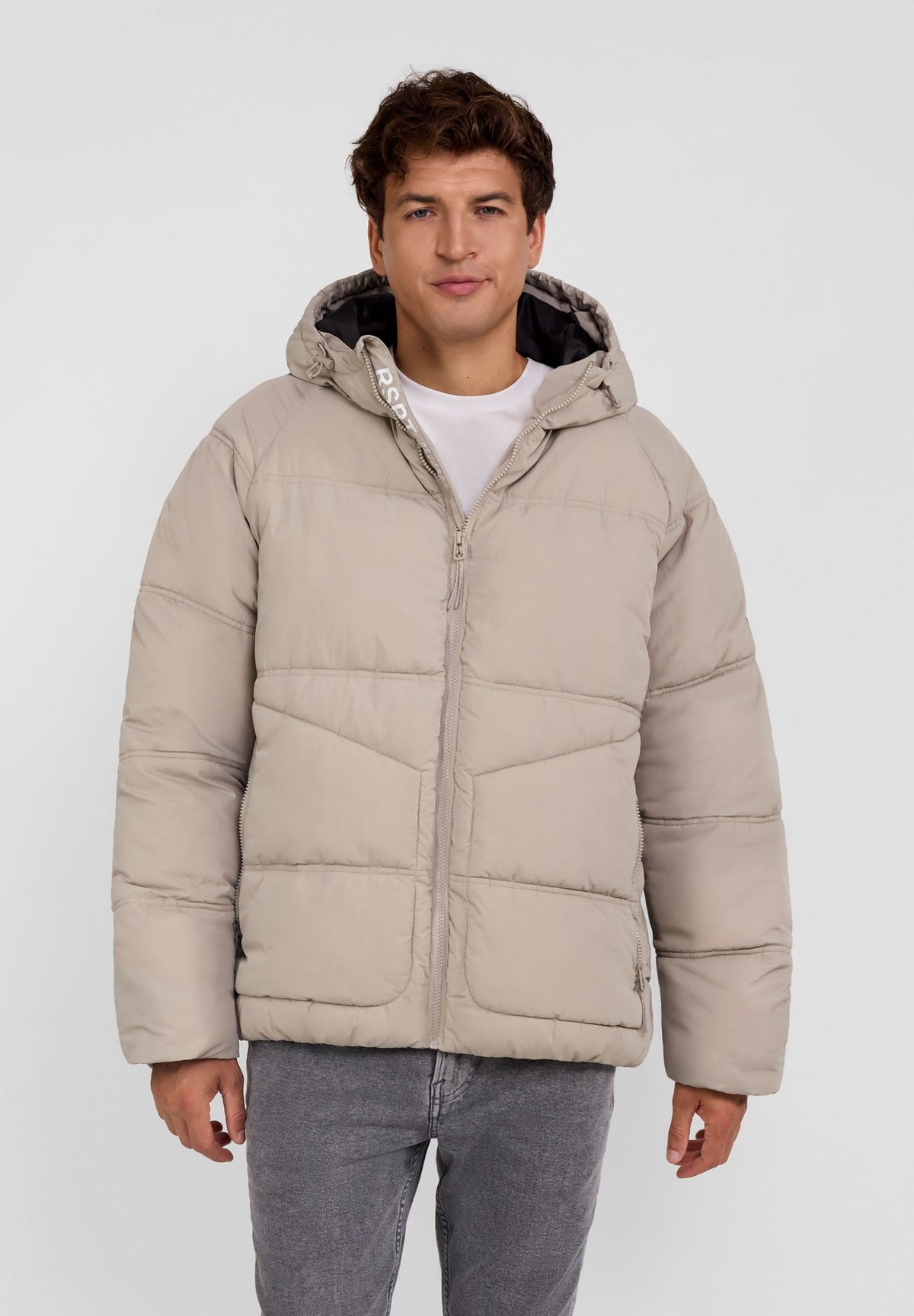 Men's light beige puffer jacket, shown worn.