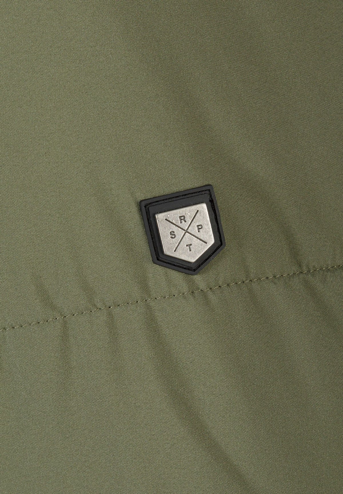 Close-up of the sleeve patch on the khaki padded parka.