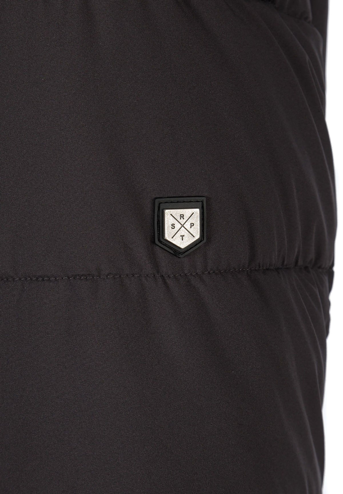 Close-up of the sleeve patch on the dark grey padded parka.