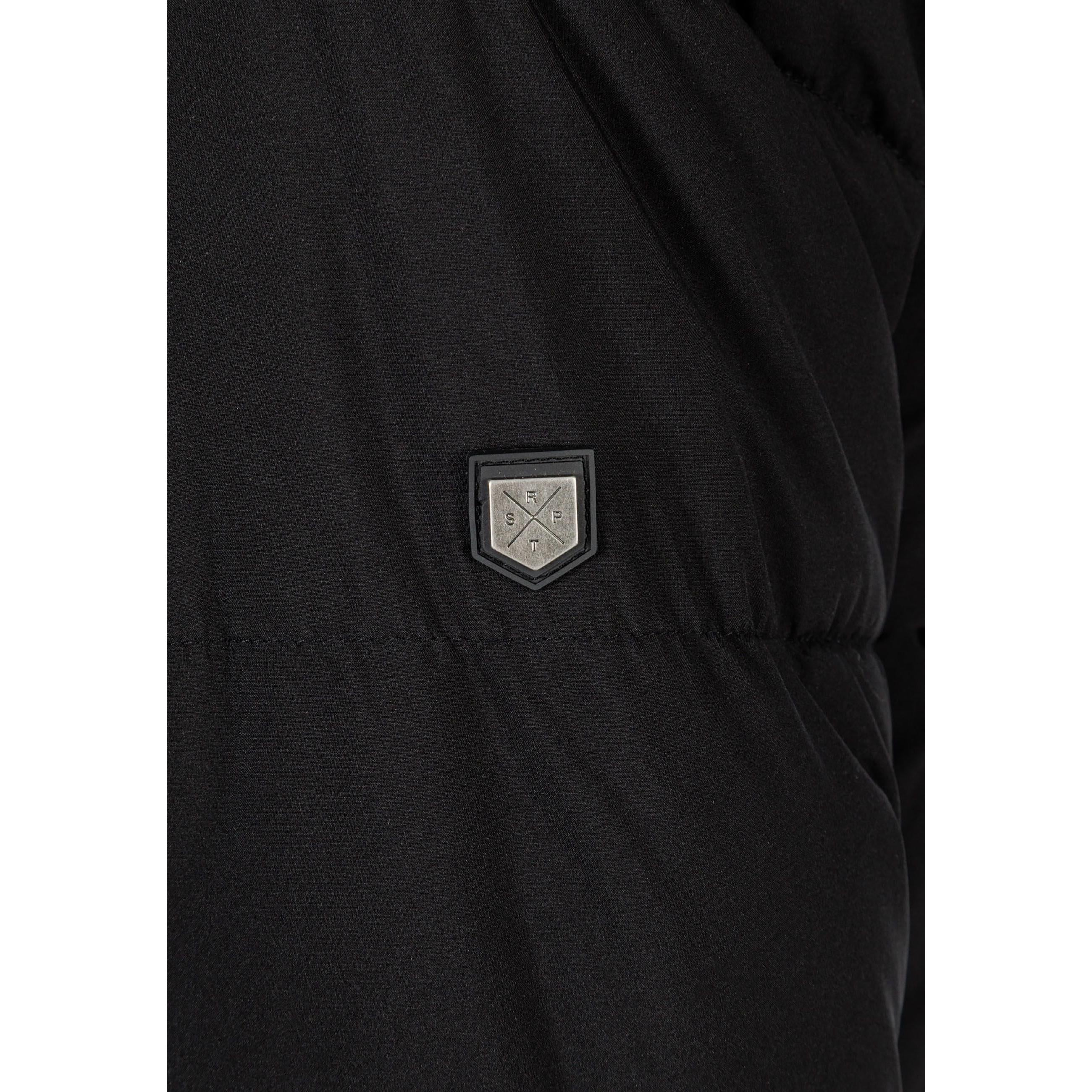 Close-up detail of black parka jacket showing hexagonal logo patch on quilted fabric